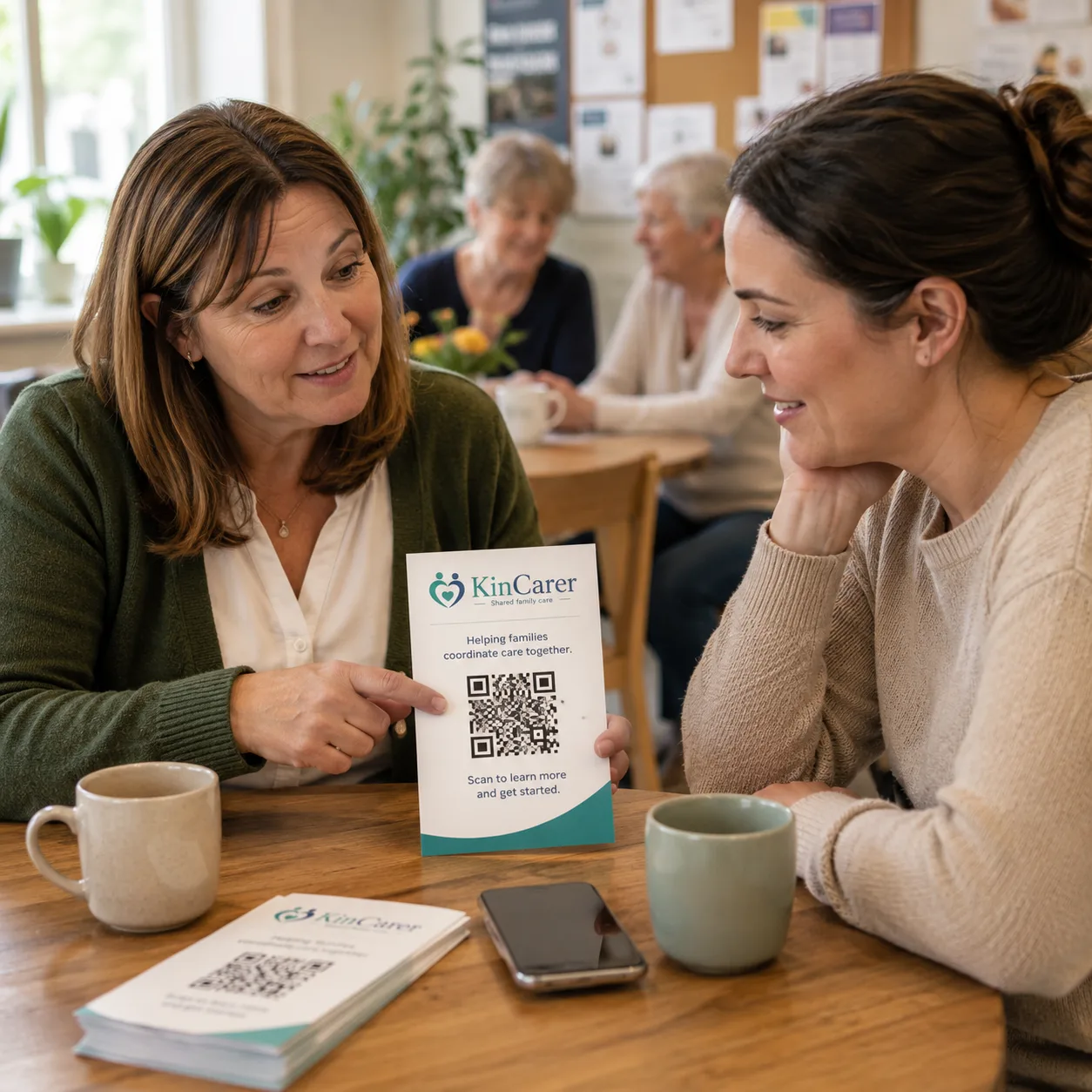 A community worker sharing a KinCarer flyer and QR code with a family over coffee