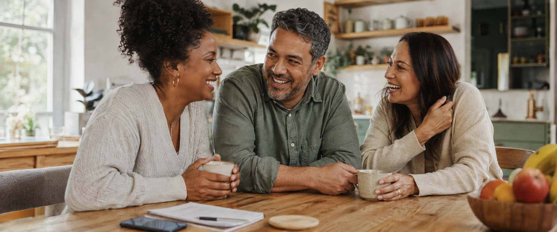 Adult siblings sitting together coordinating care for their parent